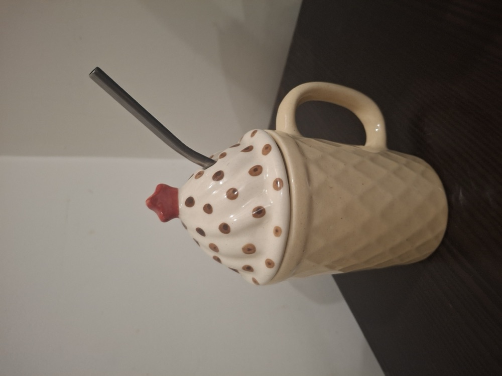 Waffle-cone ceramic mug with a polka-dot swirl lid and steel straw